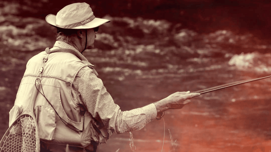Sepia-toned image of an angler holding a fly rod beside a stream.