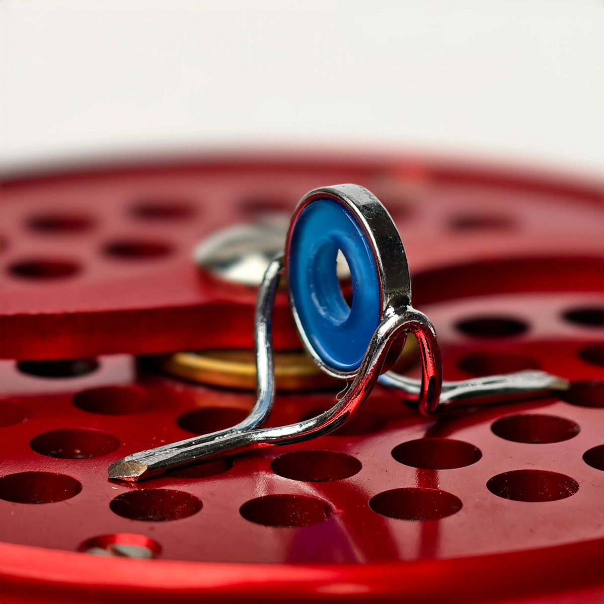 ZHUSROD blue agate fly rod stripping guide with bright nickel silver frame, detail on fly reel