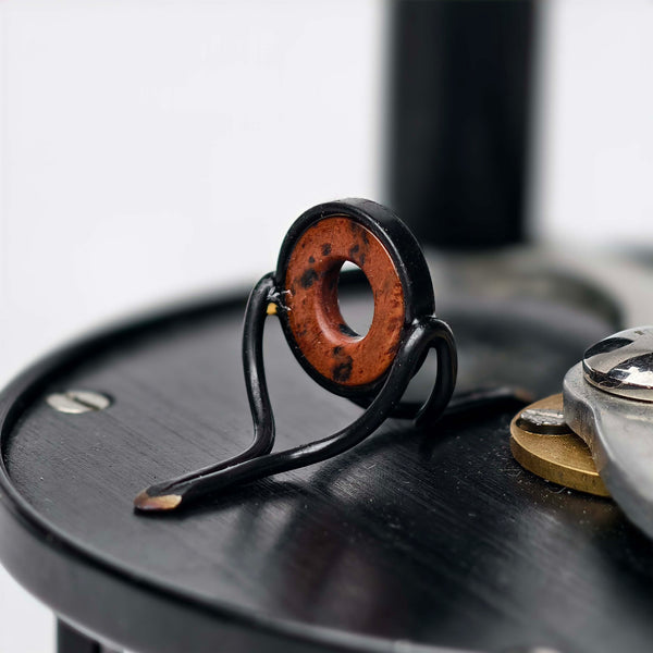 ZHUSROD dark agate fly rod stripping guide with black nickel silver frame, detail on fly reel